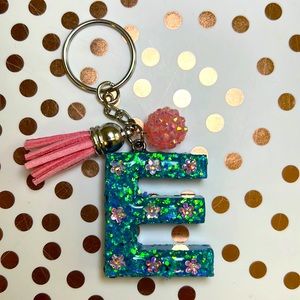 Blue and pink keychain letter E